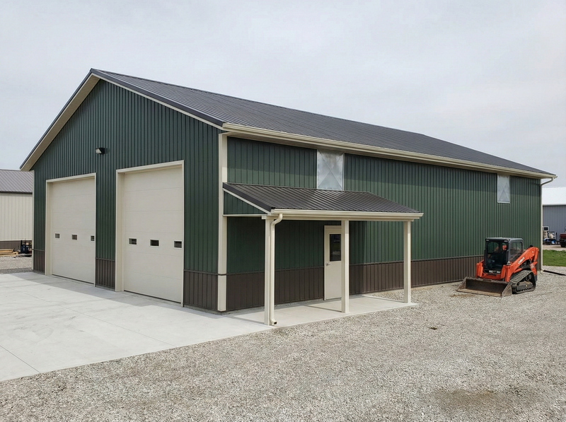 Indiana post frame two-story metal building by WVPFCO with attached carport and Bobcat equipment access area